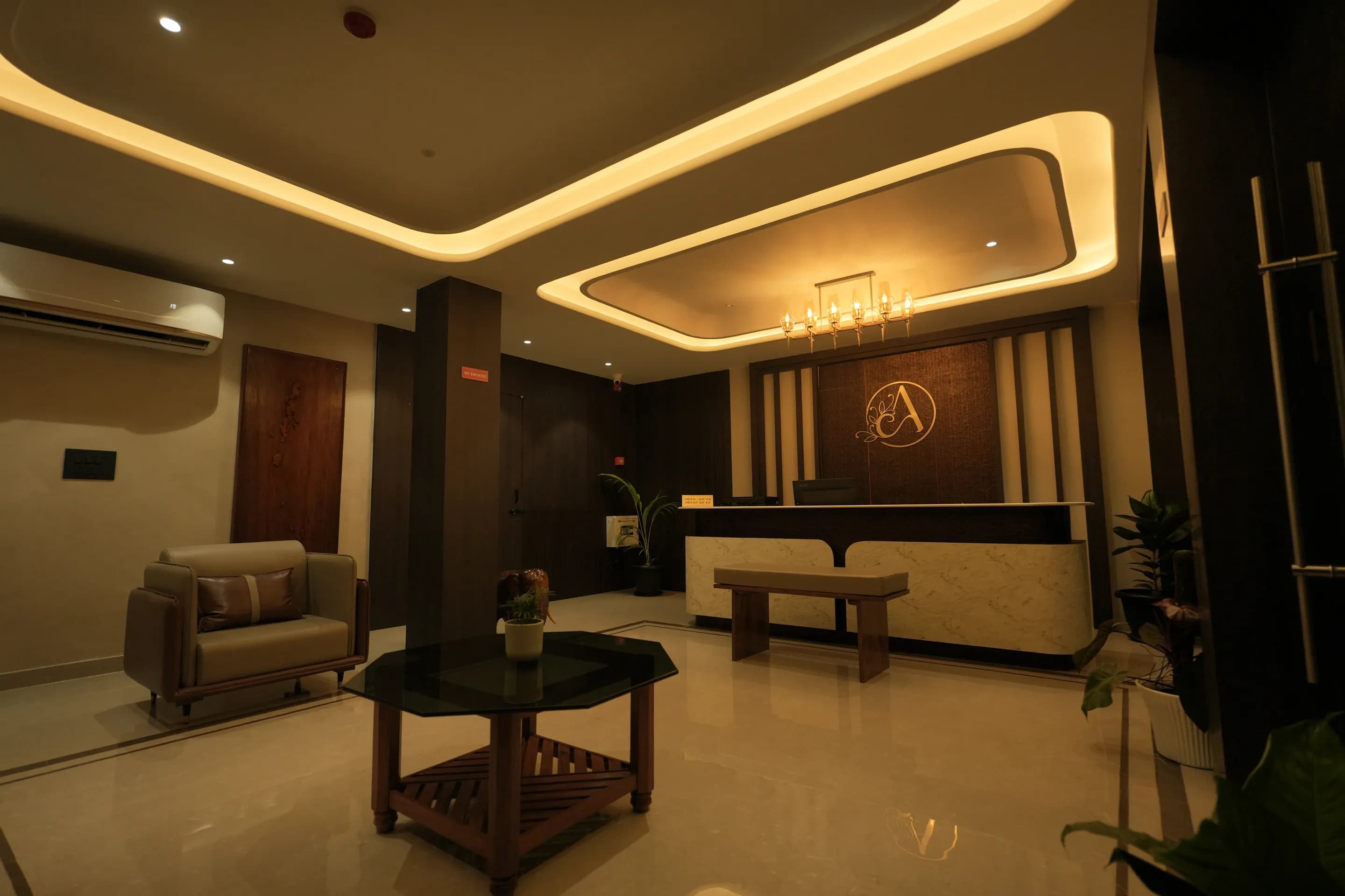 Lobby sofas and coffee table facing the reception counter